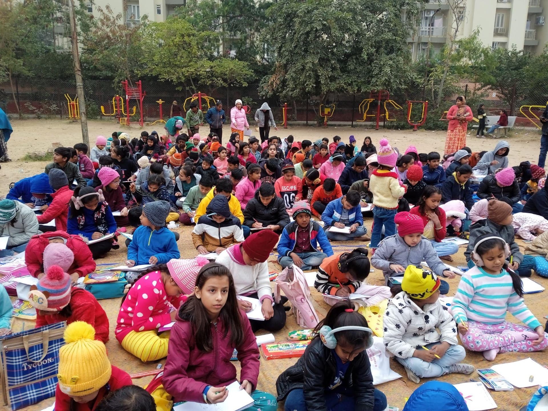 Children painting together in an art class at the Sanstha